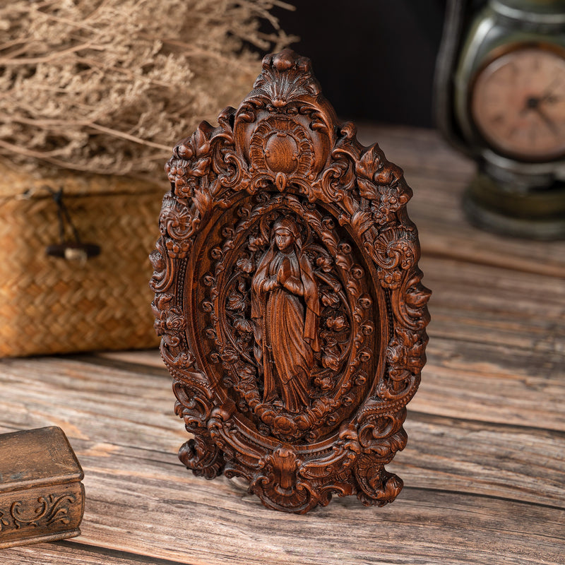 Wood carving of the Virgin Mary in leaves