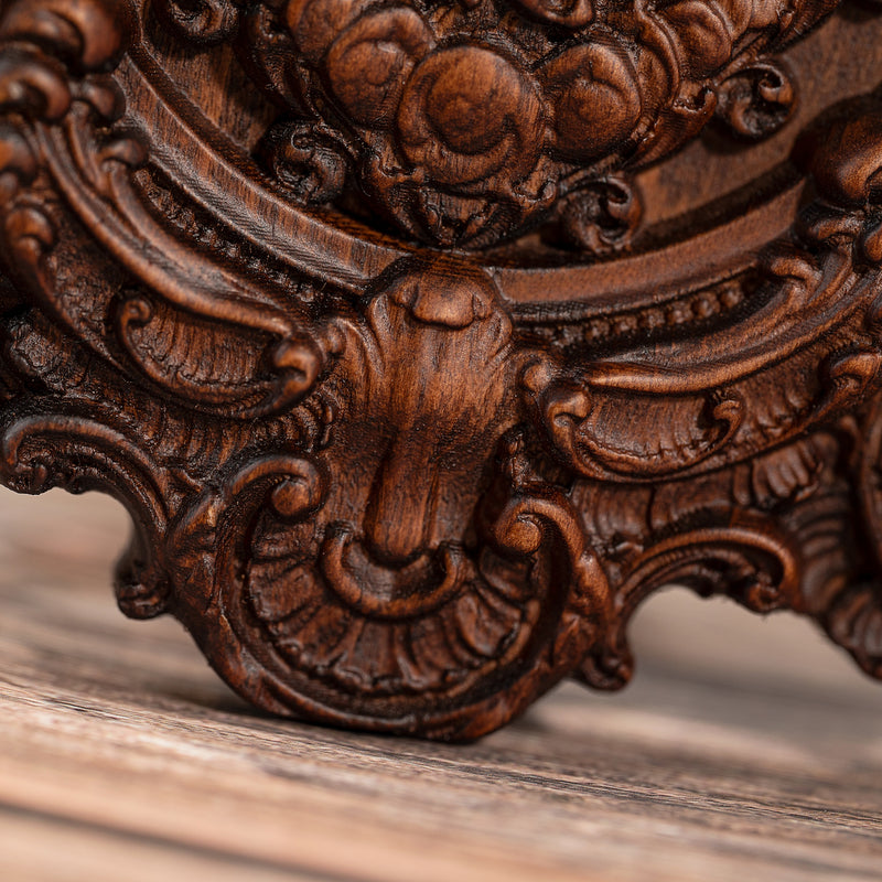 Wood carving of the Virgin Mary in leaves