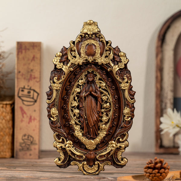 Wood carving of the Virgin Mary in leaves