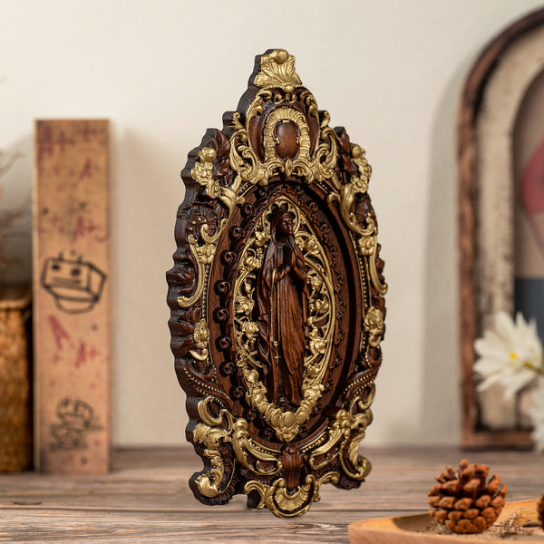 Wood carving of the Virgin Mary in leaves