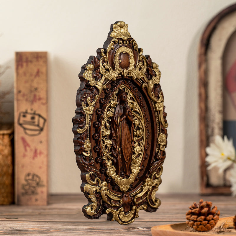 Wood carving of the Virgin Mary in leaves