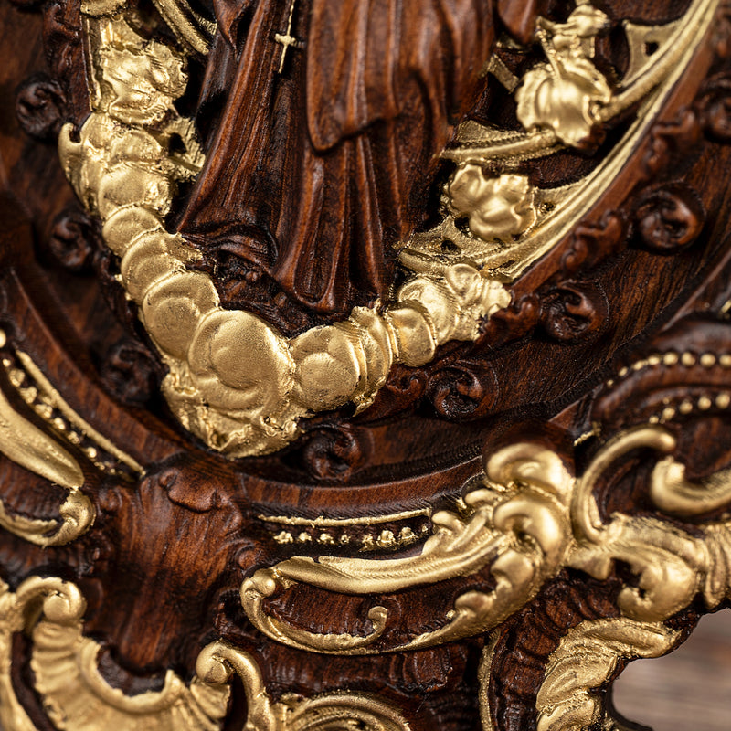 Wood carving of the Virgin Mary in leaves