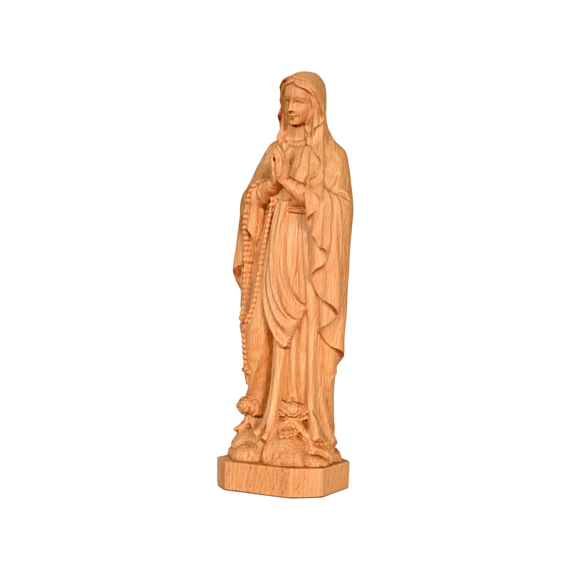 Round carving of Our Lady of Lourdes in beech wood: Sacred beauty, handcrafted technique