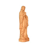 Round carving of Our Lady of Lourdes in beech wood: Sacred beauty, handcrafted technique