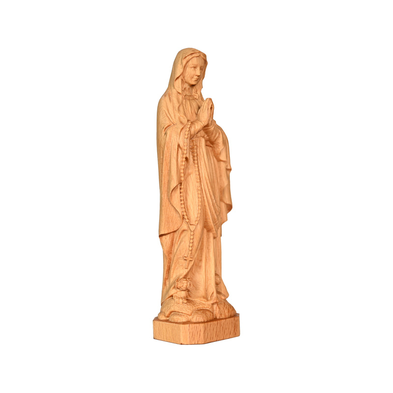 Round carving of Our Lady of Lourdes in beech wood: Sacred beauty, handcrafted technique