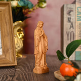 Round carving of Our Lady of Lourdes in beech wood: Sacred beauty, handcrafted technique