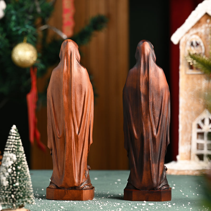 Wooden statue of Our Lady of Lourdes praying