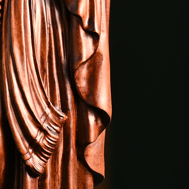 Wooden statue of Our Lady of Lourdes praying